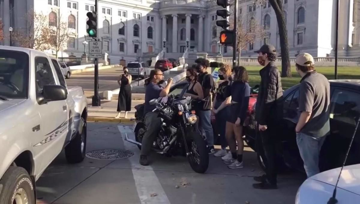 UW-Madison investigating after video shows employee on motorcycle drive through group of protesters
